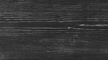 Old wooden board painted with black paint, background, textureの写真素材
