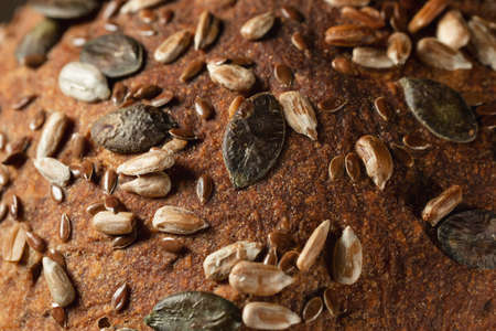 Close-up surface of homemade whole grain bread, food background, textureの写真素材