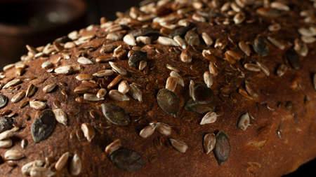 Close-up surface of homemade whole grain bread, food backgroundの写真素材