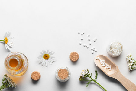 Homeopathic medicines and medicinal plants on a light background, copy spaceの写真素材