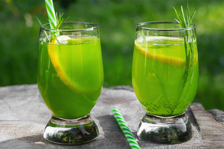 Homemade summer refreshing tarragon lemon drink on patio tableの写真素材