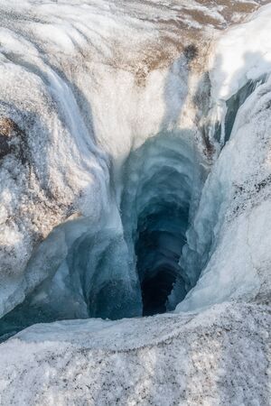 Water drain hole in top of a glacier, Svalbardの写真素材
