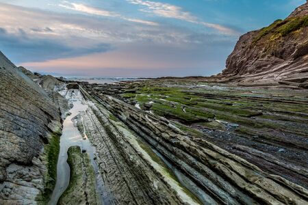 Zumaia flysch coast at sunset, Euskadiの写真素材