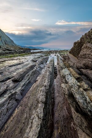 Zumaia flysch coast at sunset, Euskadiの写真素材