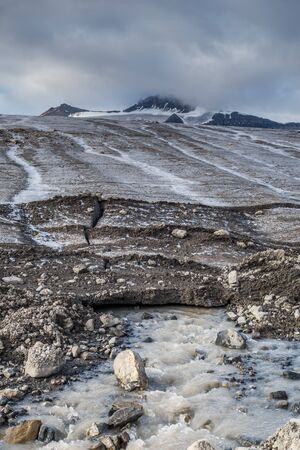 Water draining under the permafrostの写真素材