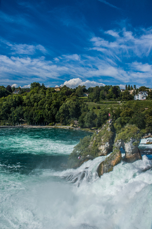 Rhine Falls water flow and rocksの写真素材