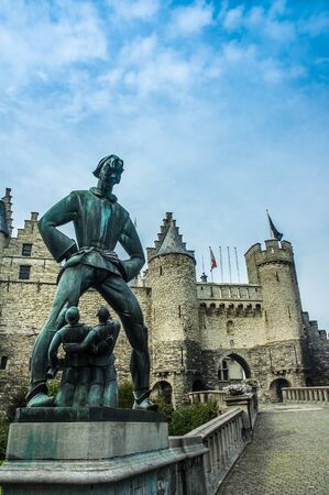 The statue of the mythical giant, Lange Wapper, outside the Het Steen or Stone Castle, in Antwerp, Belgiumの写真素材