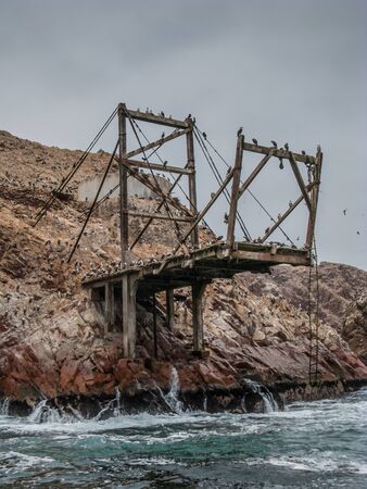 Abandoned guano loading stand in Ballestas islands, Peruの写真素材