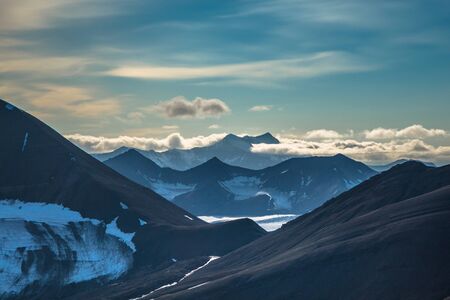 Glacier and mountain range under the clouds, Svalbard