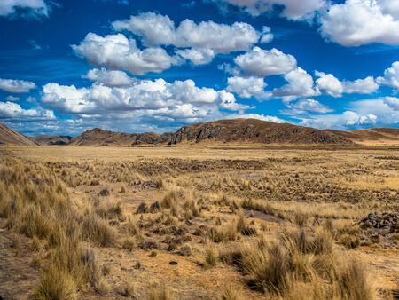 Blue sky with clouds in the roads of Puno, Peru