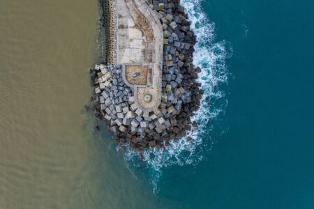 Concrete block cubes seawall and breakwater in Zumaia, Basque Countryの写真素材