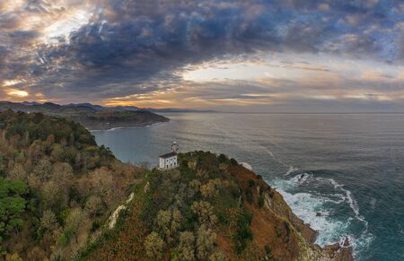Getaria lighthouse at dusk, Basque country - drone aerial viewの写真素材