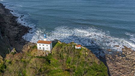 Zumaia lighthouse in Gipuzkoa, Basque country - drone aerial viewの写真素材