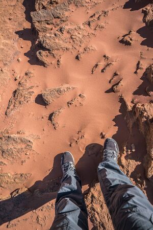 Feet in Wadi Rum Desert red sands, Jordanの写真素材
