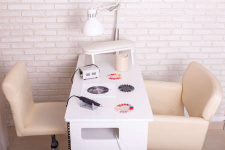 Working place for nail care master in beauty salon. Modern design and interior.の写真素材