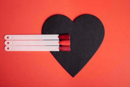 Romantic color palettes of red nail gel polish for manicure and pedicure nails, heart designの写真素材