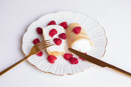 Sweet dessert, ice cream with raspberries on white plate