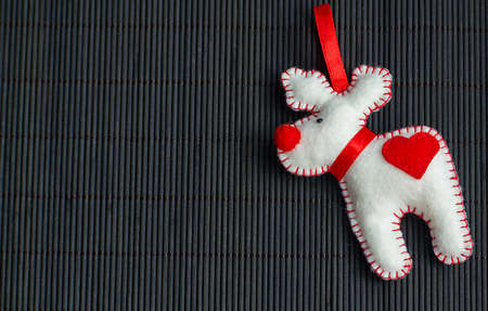 Christmas tree with toys and decorative snow for a happy new yearの写真素材