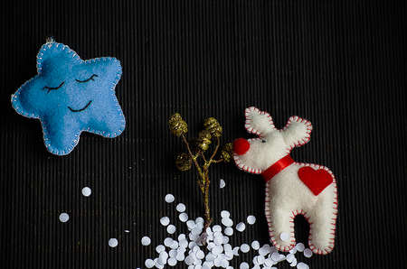 Christmas tree with toys and decorative snow for a happy new yearの写真素材