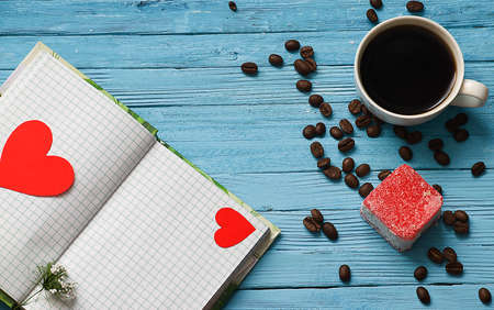 Cooked black coffee with sweet marshmallow on a blue wooden tableの写真素材