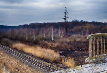 Old bridge near forest and close to the railway sunset