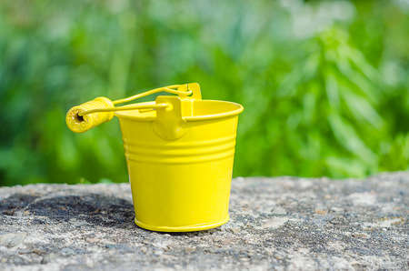 bucket, plant pots with objects in it with back backgroundの写真素材