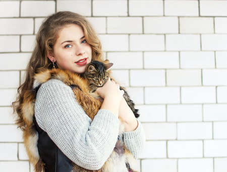 Young happy girl in the winter in the fresh airの写真素材