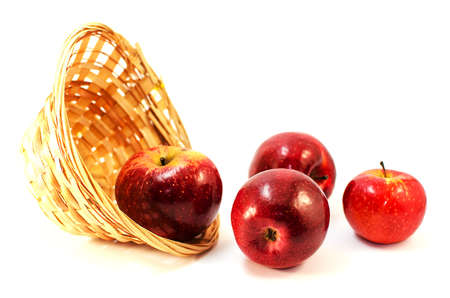 Apples on a limited background in the basket and juiceの写真素材