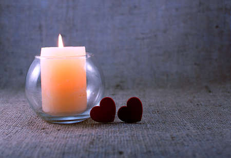 A scented candle on the background for a good mood and relaxation