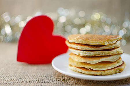 Fried pancakes are a mountain on a plate of sweets for a healthy breakfastの写真素材