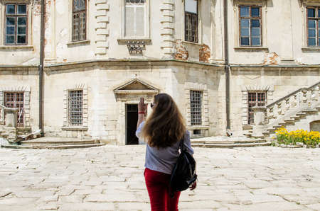 Young smiling girl with curly hair on the backgroundの写真素材
