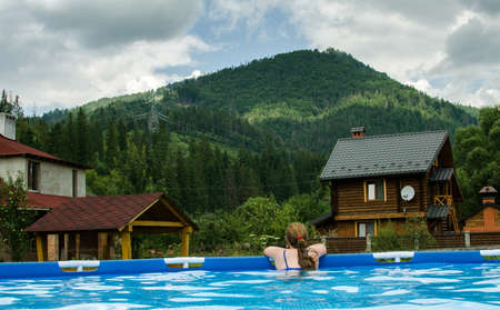 Young smiling girl with curly hair on the backgroundの写真素材