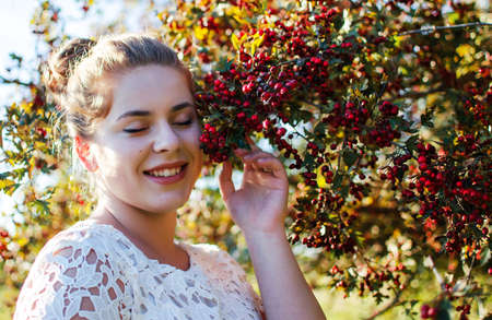 Young smiling girl with curly hair on the backgroundの写真素材