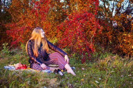 Young smiling girl with curly hair on the backgroundの写真素材