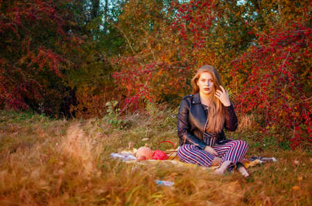 Young smiling girl with curly hair on the backgroundの写真素材