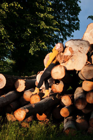 Happy girl with long hair walking in the spring outdoorsの写真素材