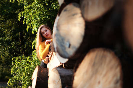 Happy girl with long hair walking in the spring outdoorsの写真素材