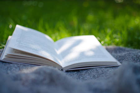 Open book and flowers for a good rest and readingの写真素材