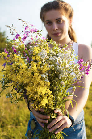 Happy girl with long hair walking in the spring outdoorsの写真素材