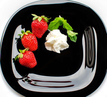 Red delicious strawberries for desserts and fresh juices in summer for ice cream on a limited backgroundの写真素材