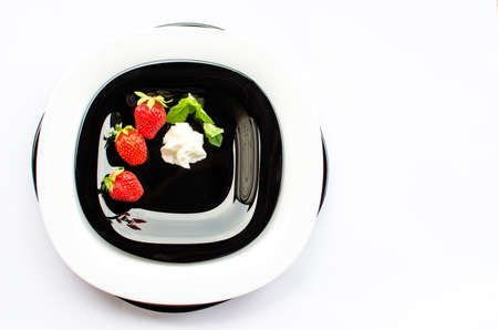 Red delicious strawberries for desserts and fresh juices in summer for ice cream on a limited backgroundの写真素材