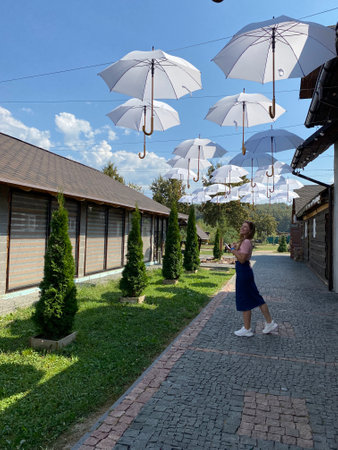 Happy girl with long hair walking in the spring outdoorsの写真素材
