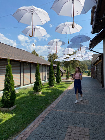 Happy girl with long hair walking in the spring outdoorsの写真素材