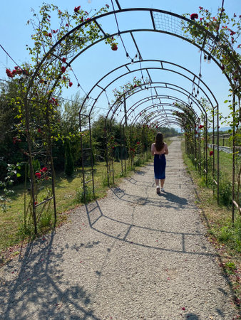 Happy girl with long hair walking in the spring outdoorsの写真素材
