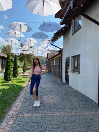 Happy girl with long hair walking in the spring outdoorsの写真素材
