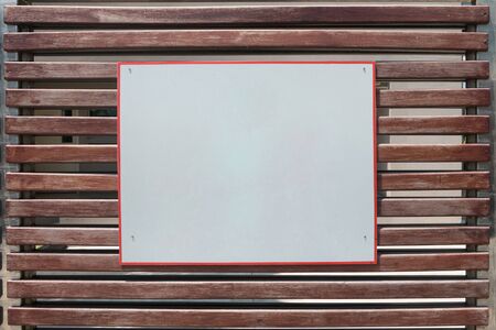 white placard board on wooden gate. You can write your information text on empty signboard.の写真素材