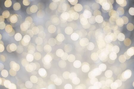white bokeh light blurred, holiday abstract background, blur defocusedの写真素材