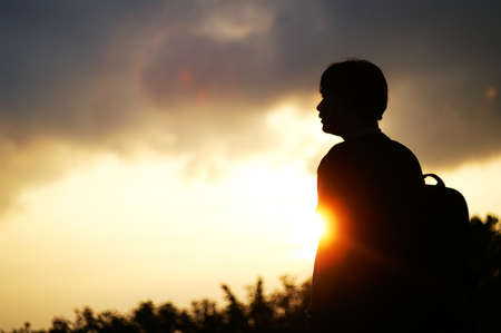 silhouette in outdoor with dramatic sunset.の写真素材