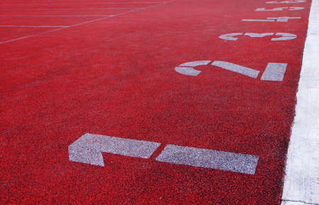  Numbered lanes on red track                   の写真素材
