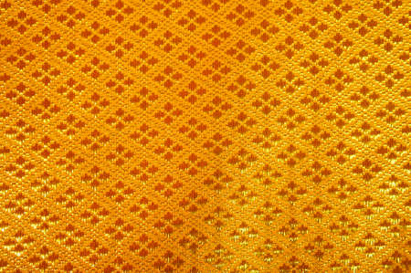           Golden satin, silk, waves. Yellow background     の写真素材